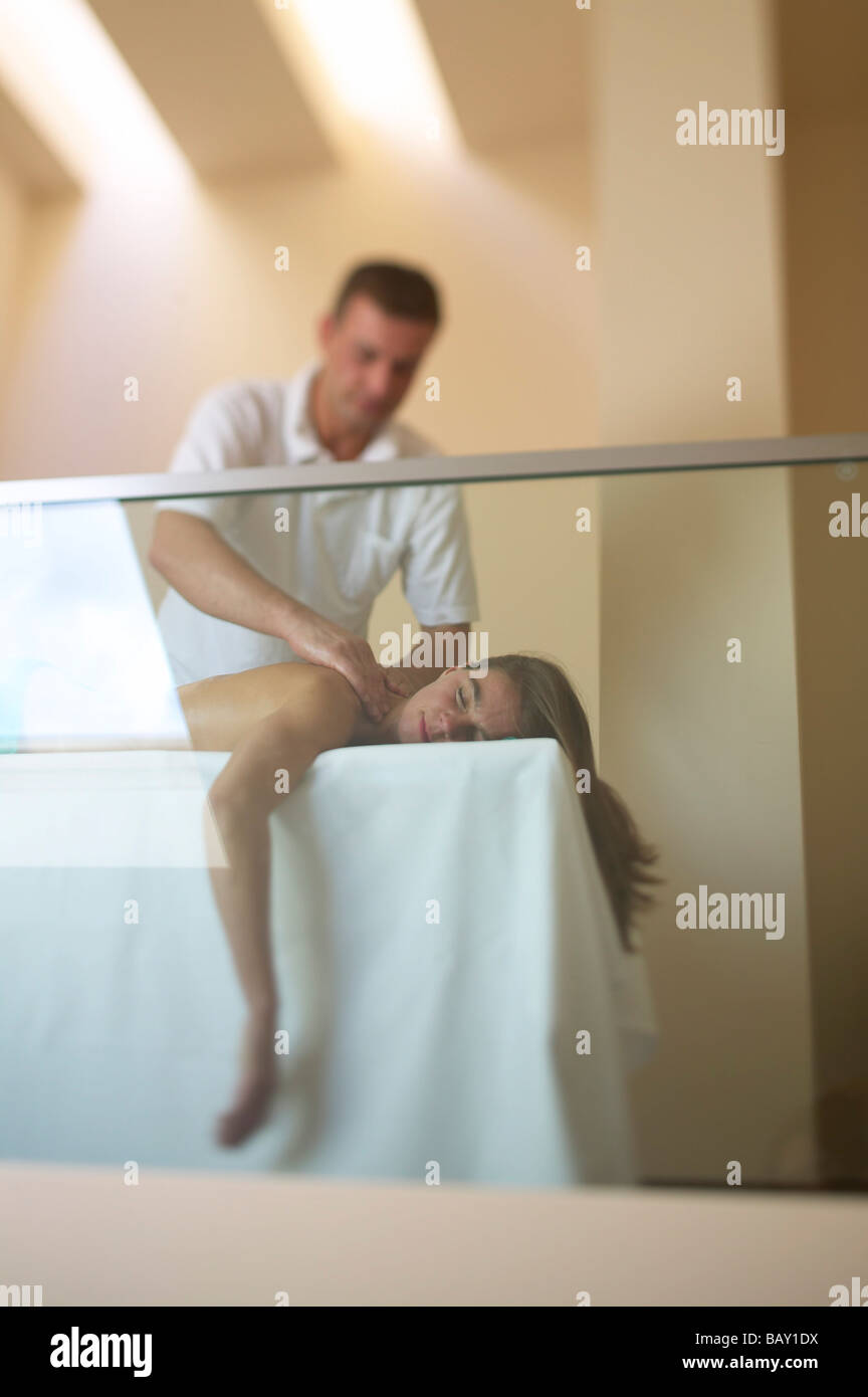 Massage, woman relaxing, physiotherapist massaging his customer, personal spa area of Seehotel Neuklostersee, Badescheune, Meckl Stock Photo