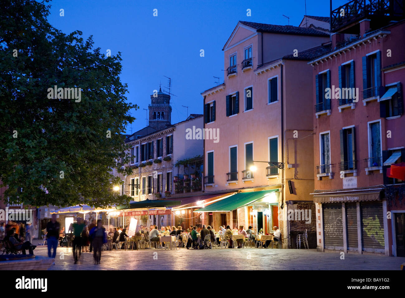 People sitting outside a restaurant bar, Campo Santa Margherita, Venice, Veneto, Italy Stock Photo