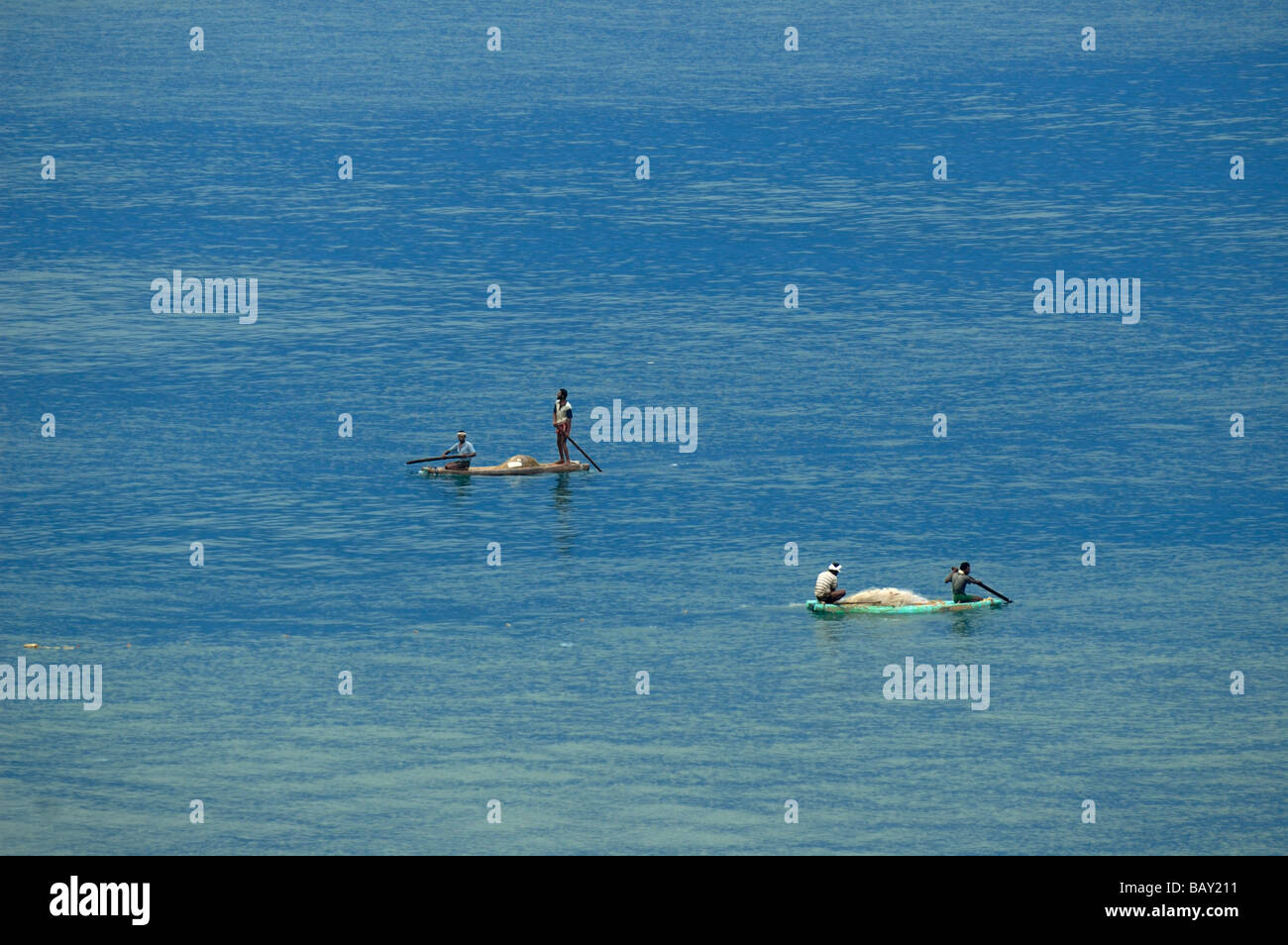 Indian fishermen in their small boats fishing in the sea at Varkala, Kerala. India, Kerala.  No releases available. Stock Photo