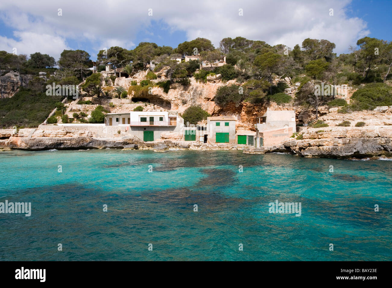 Fishing Boat Garages at Cala Llombards Cove, Cala Llombards, Mallorca, Balearic Islands, Spain Stock Photo