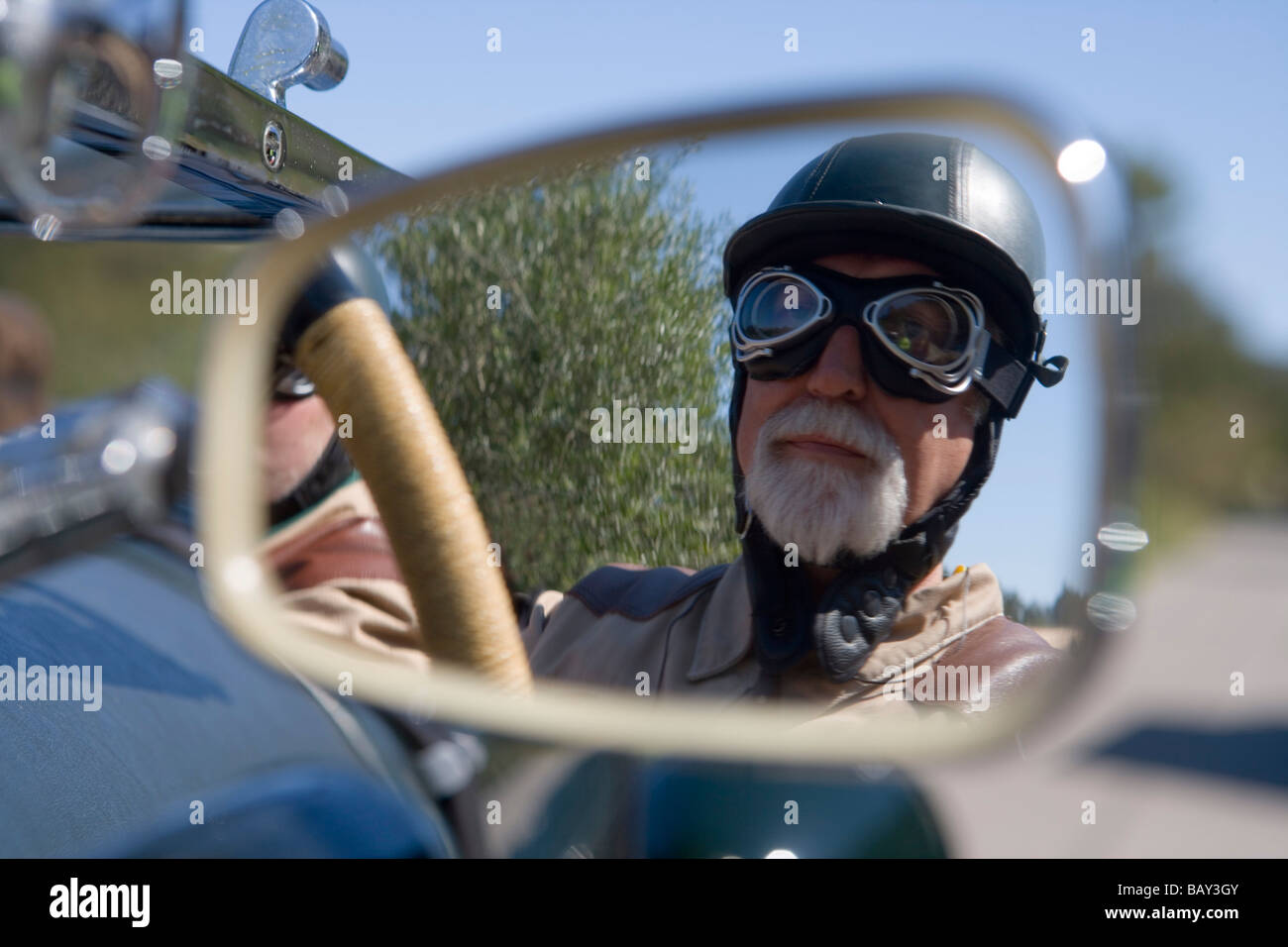 Mirror Reflection of Rallye Driver Bender in 1929 Bentley Le Mans, Rally Classico Isla Mallorca, near Campanet, Mallorca, Balear Stock Photo