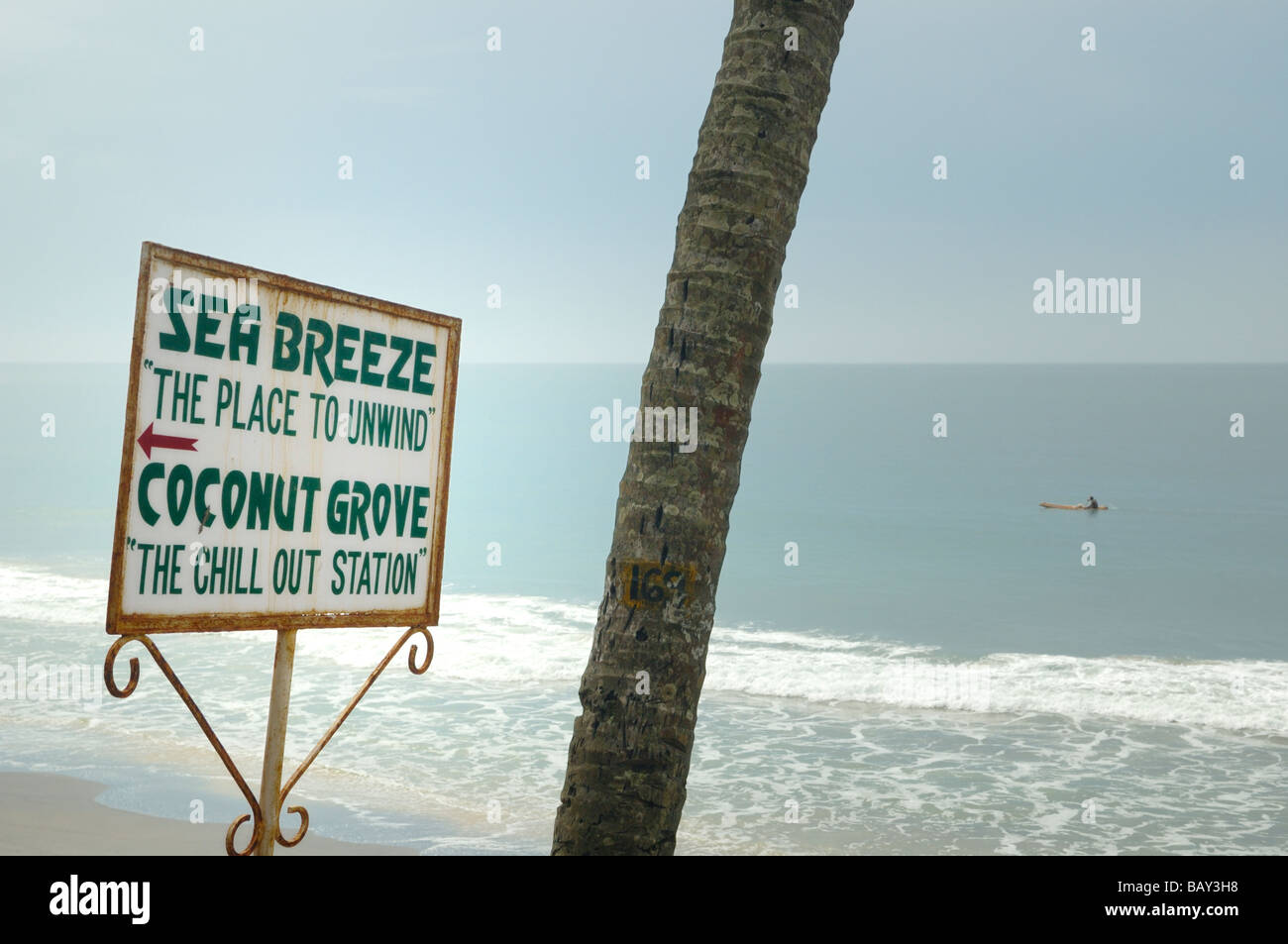 Sign against sea and sky promoting The Chill Out Station. Varkala beach, Kerala, India.  No releases available. Stock Photo