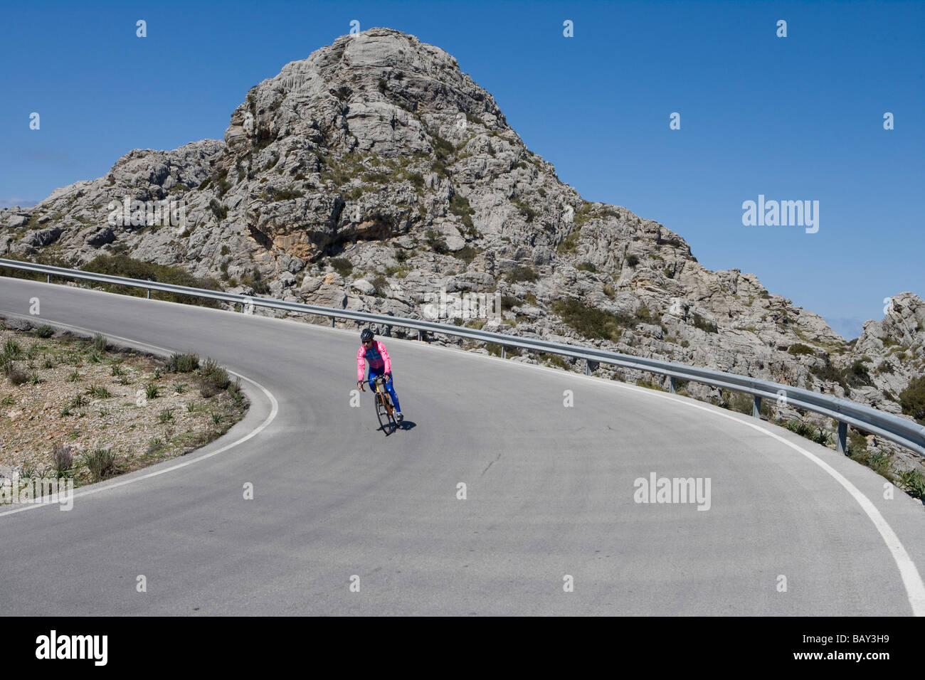 Cyclist on Sa Calobra Mountain Road, Near Cala de Sa Calobra, Mallorca, Balearic Islands, Spain Stock Photo