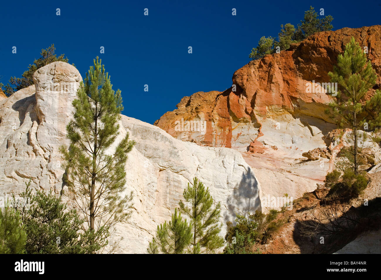 Colorado Provencal, rocks of ochre under a blue sky, Rustrel, Vaucluse, Provence, France Stock Photo
