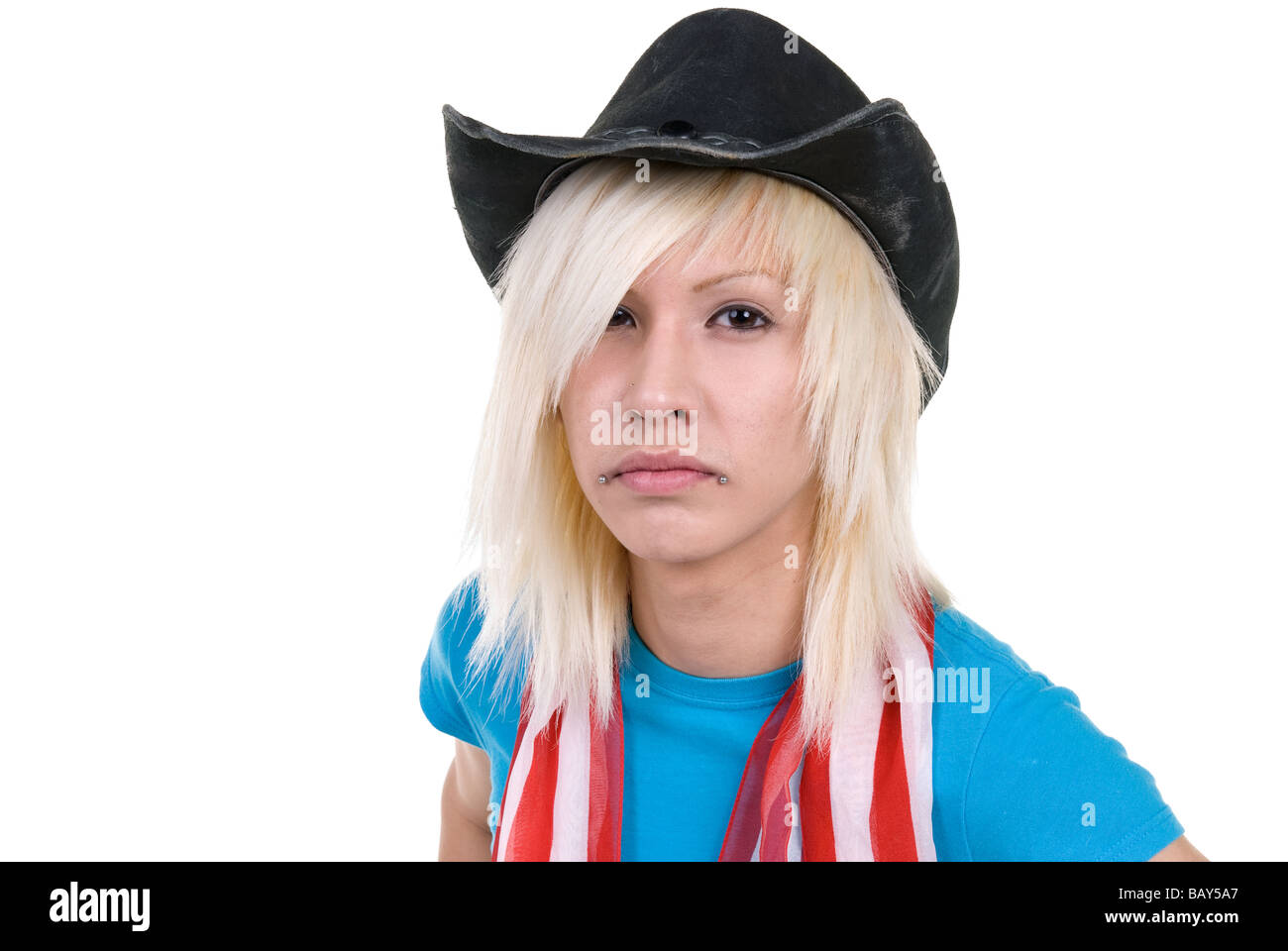 A young man expresses himself through his clothing and piercings Stock Photo