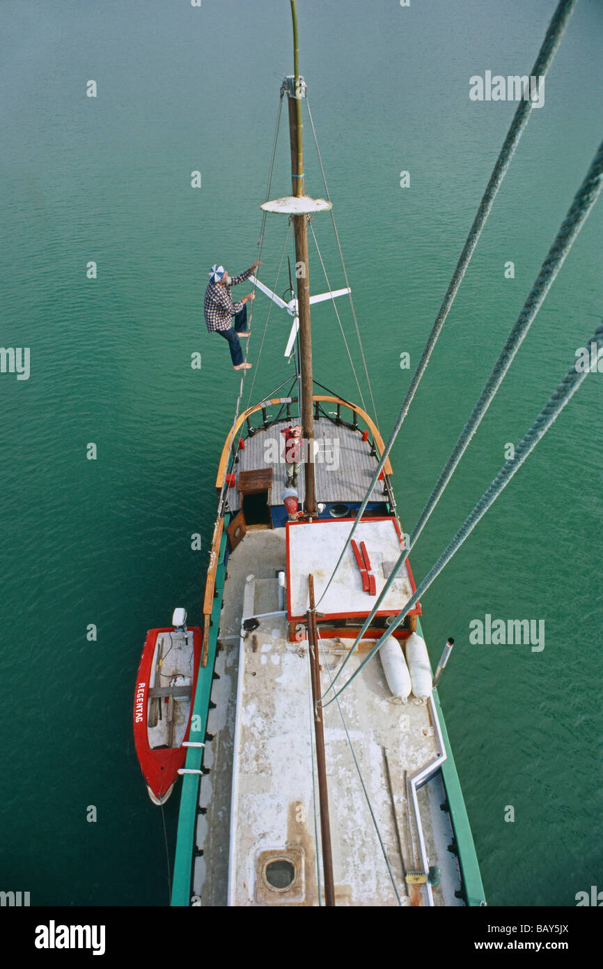 Friedensreich Hundertwasser climbs the mast of his boat Regentag, New Zealand Stock Photo