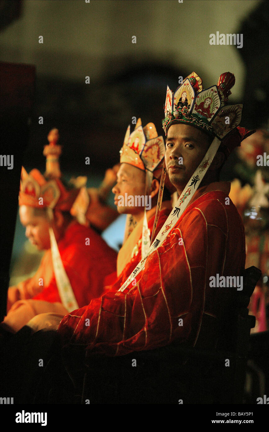 High-ranking monks at prayer service at Qiyuan monastery, Jiuhuashan ...