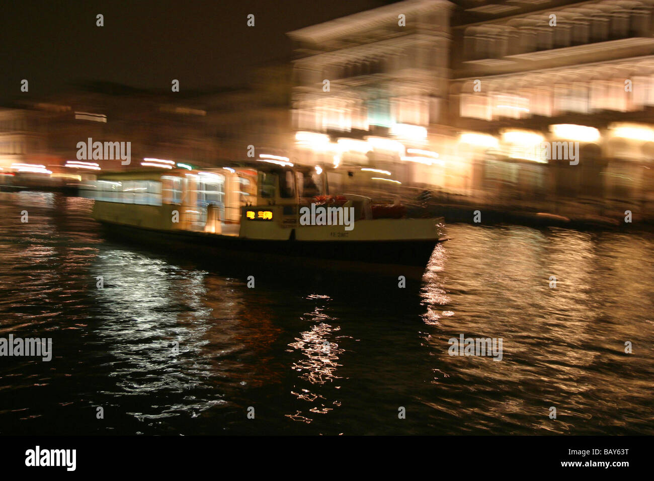 Vaporetto drives on Canale Grande in the night in Venice, Italy Stock Photo