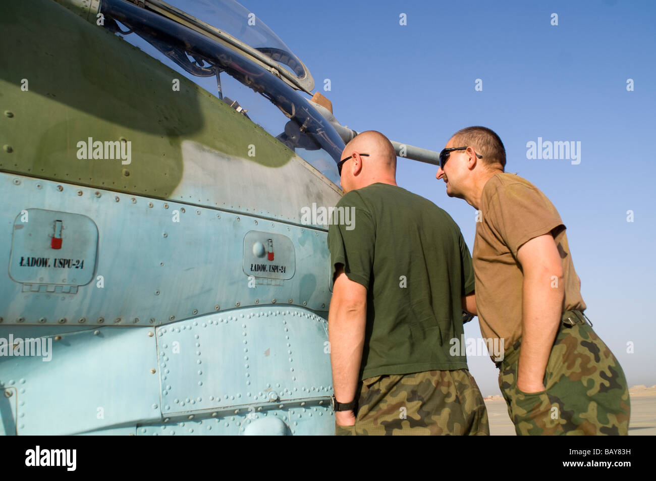 Polish military crews servicing and flying Mi-24 HIND-D helicopters in Iraq's Wasit province. Stock Photo