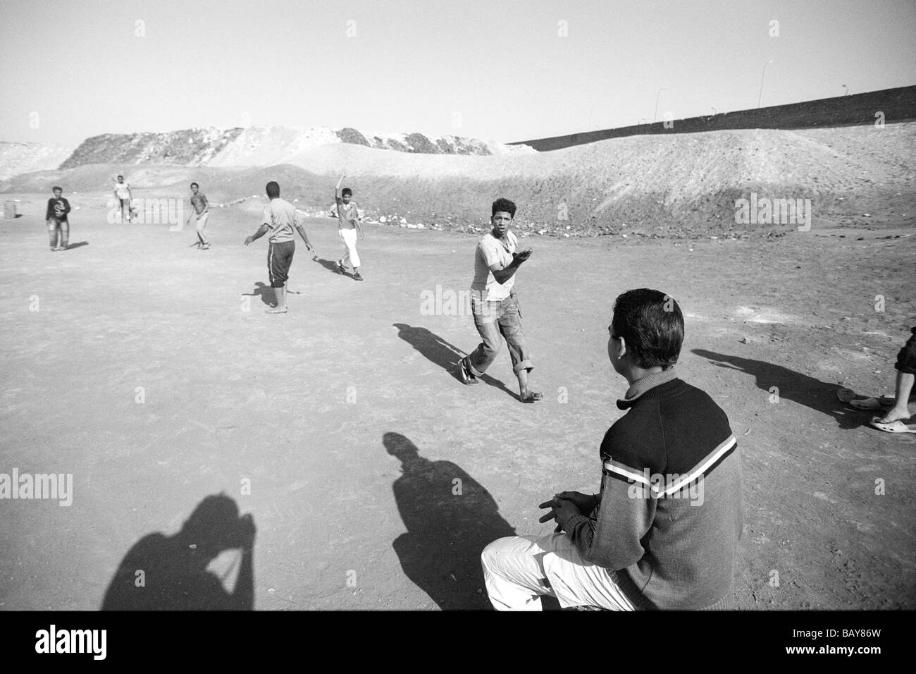 Boys playing soccer at dump in the Fustat quarter of Cairo. Stock Photo