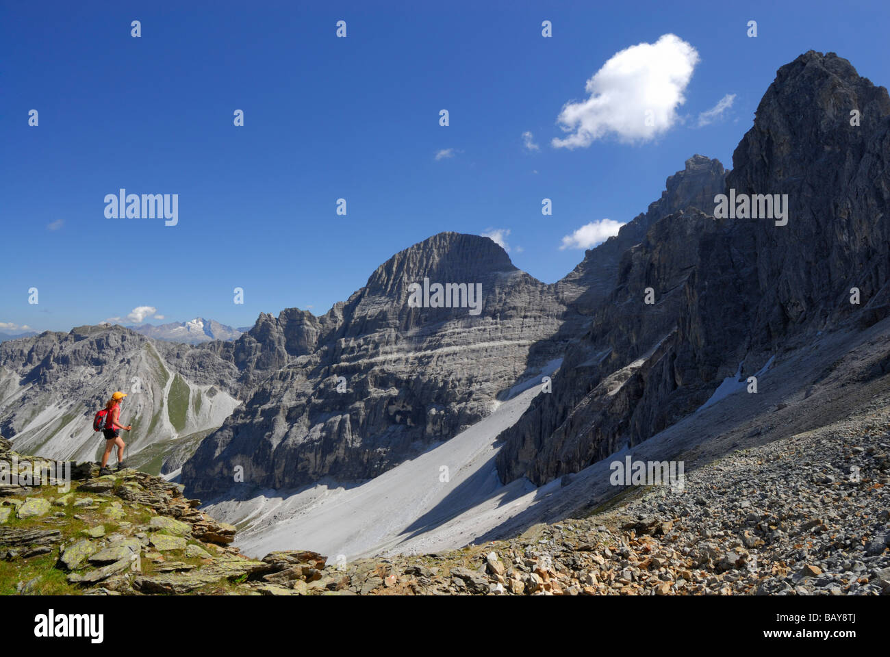 young woman hiking in front of Tribulaun range, Stubaier Alpen range, Stubai, Tyrol, Austria Stock Photo