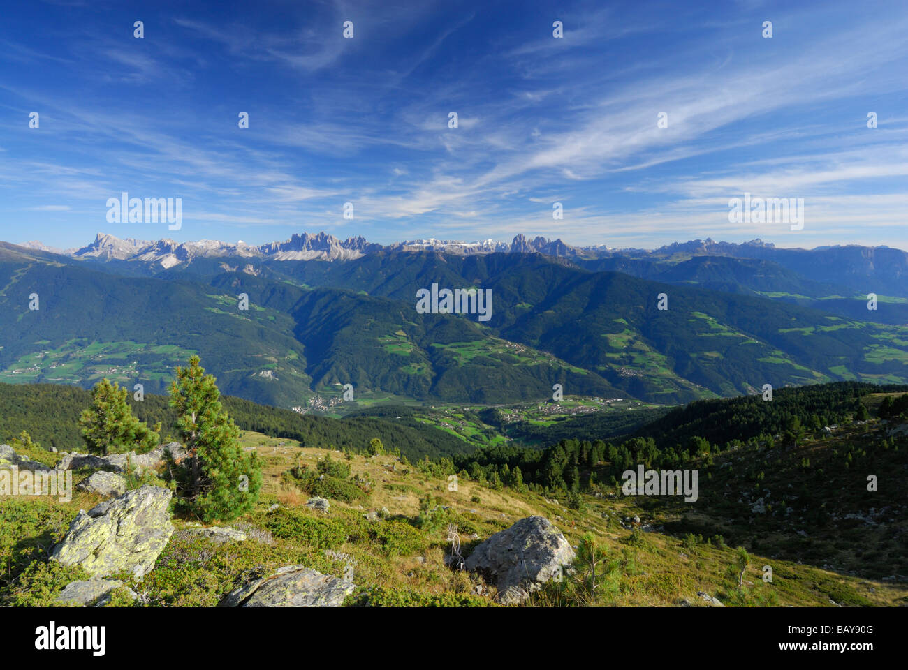view from hut Radlseehuette to valley of river Eisack near Klausen and to Dolomites with Peitlerkofel, Geislergruppe, Sella with Stock Photo