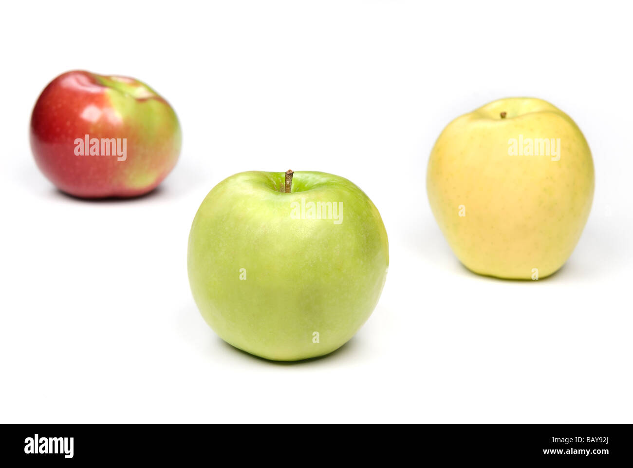 Three apples show the variety of this fruit and hold a healthy eating