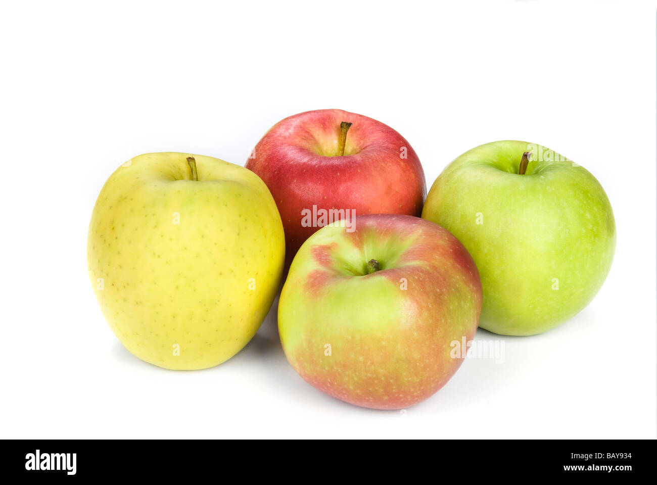 Four apples show the variety from yellow to granny smith to a common red apple Stock Photo