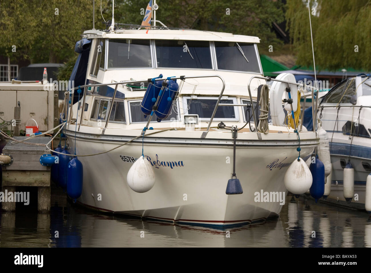 Norfolk Broads cabin cruiser moored Stock Photo