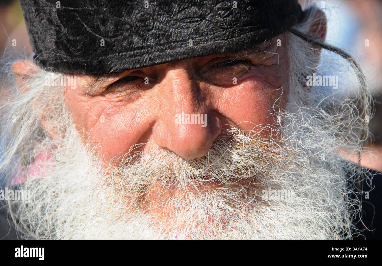 Portrait of a priest at the annual mass-baptism on the River Jordan in Israel. Stock Photo