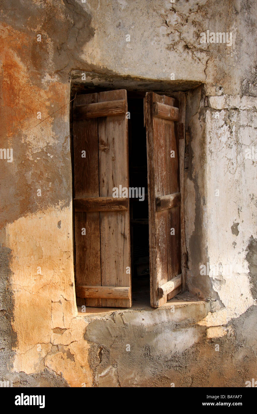 Old window with shutters in a backstreet in Kalkan, Antalya, Turkey Stock Photo