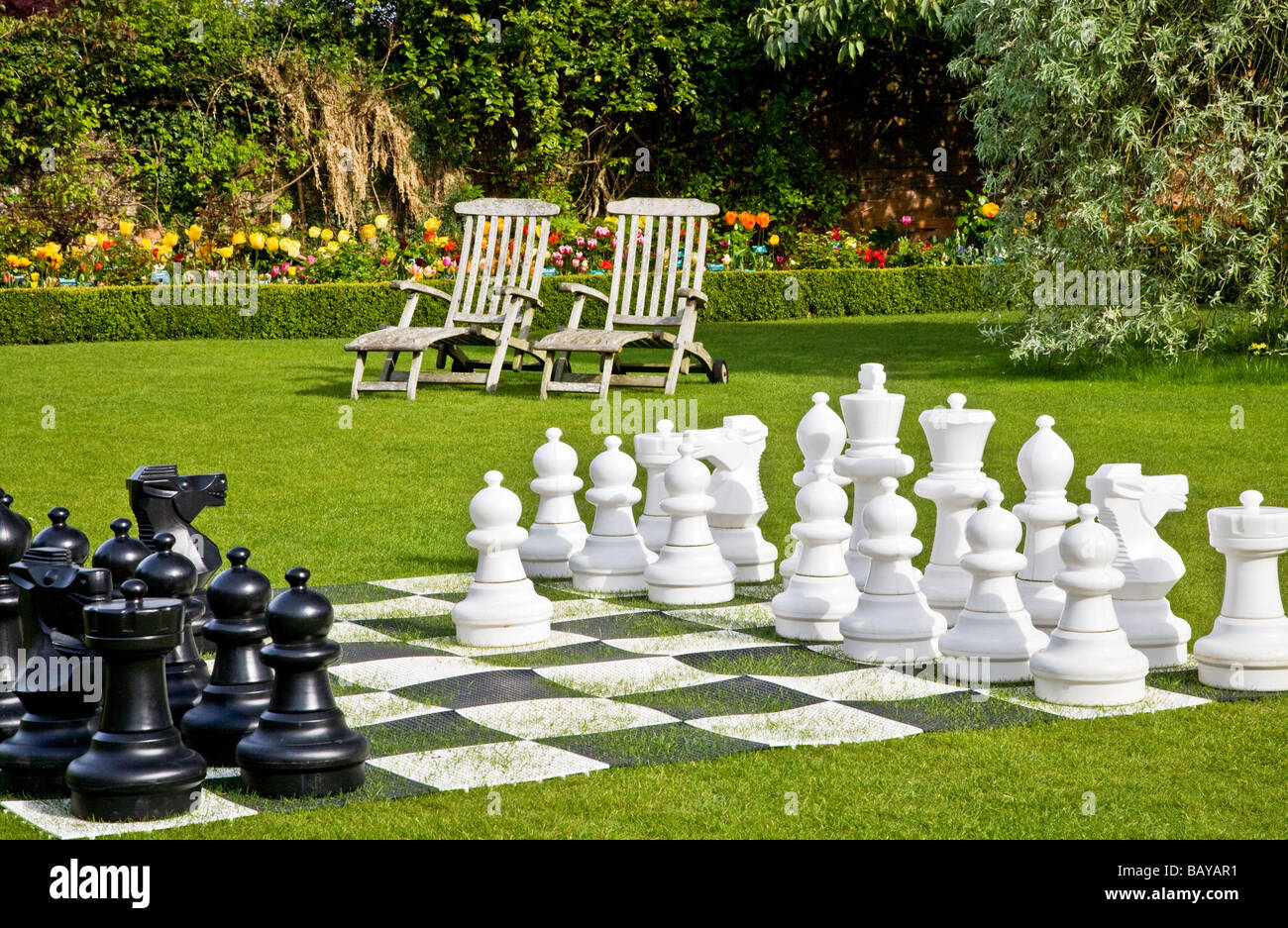 Giant chess set on the lawn at Abbey House Gardens Malmesbury Wiltshire England UK Stock Photo