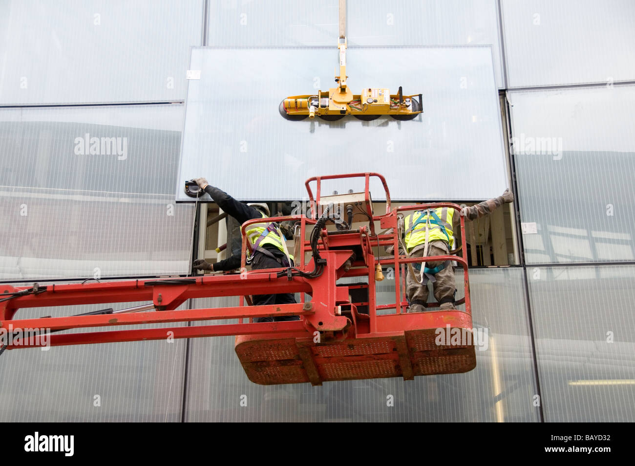 Construction workers installing new windows window hi-res stock ...
