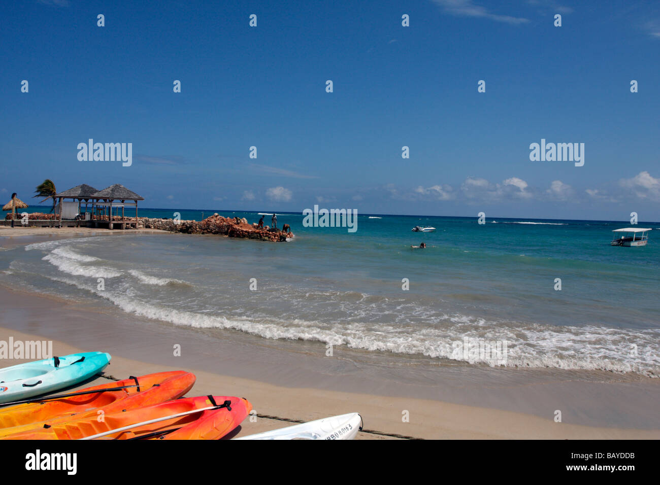 Beach and jetty break at Royal Decameron resort in Runaway Bay, Jamaica. In the background one can see workers on jetty. Stock Photo