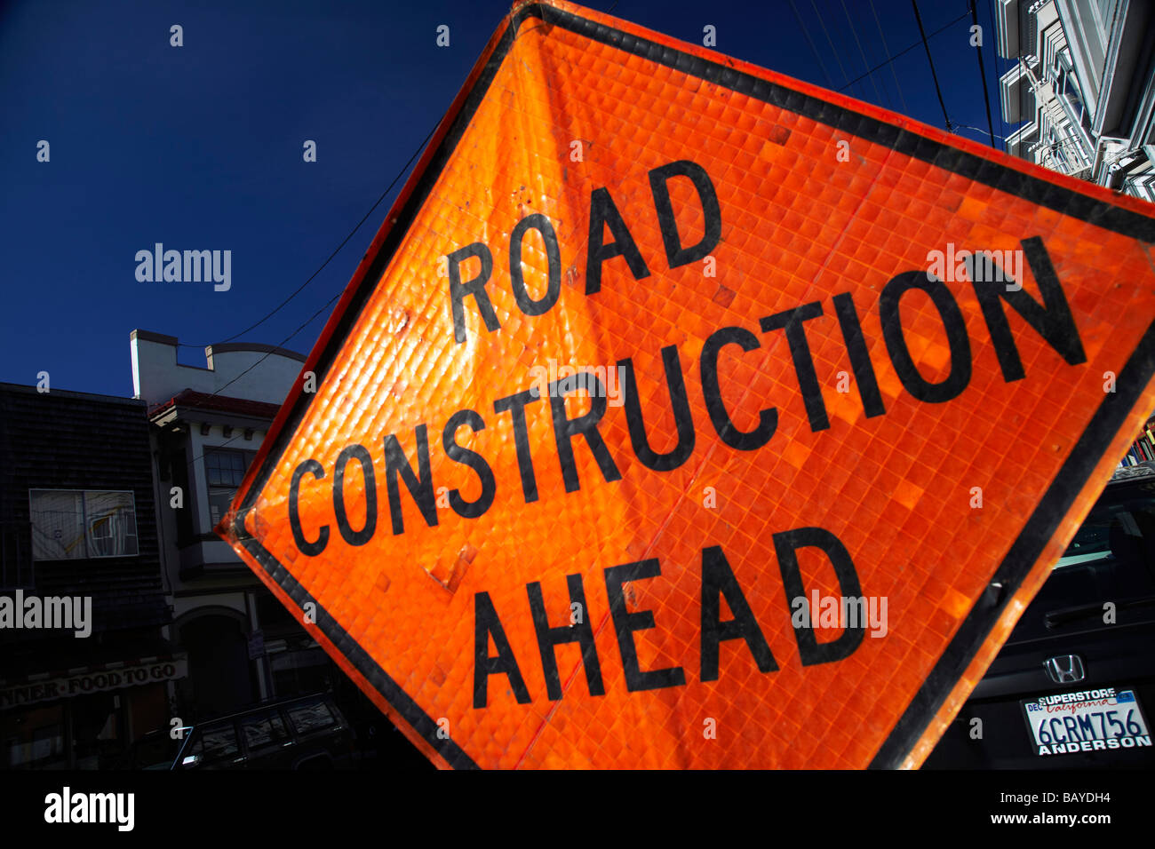 orange road construction ahead sign Stock Photo Alamy