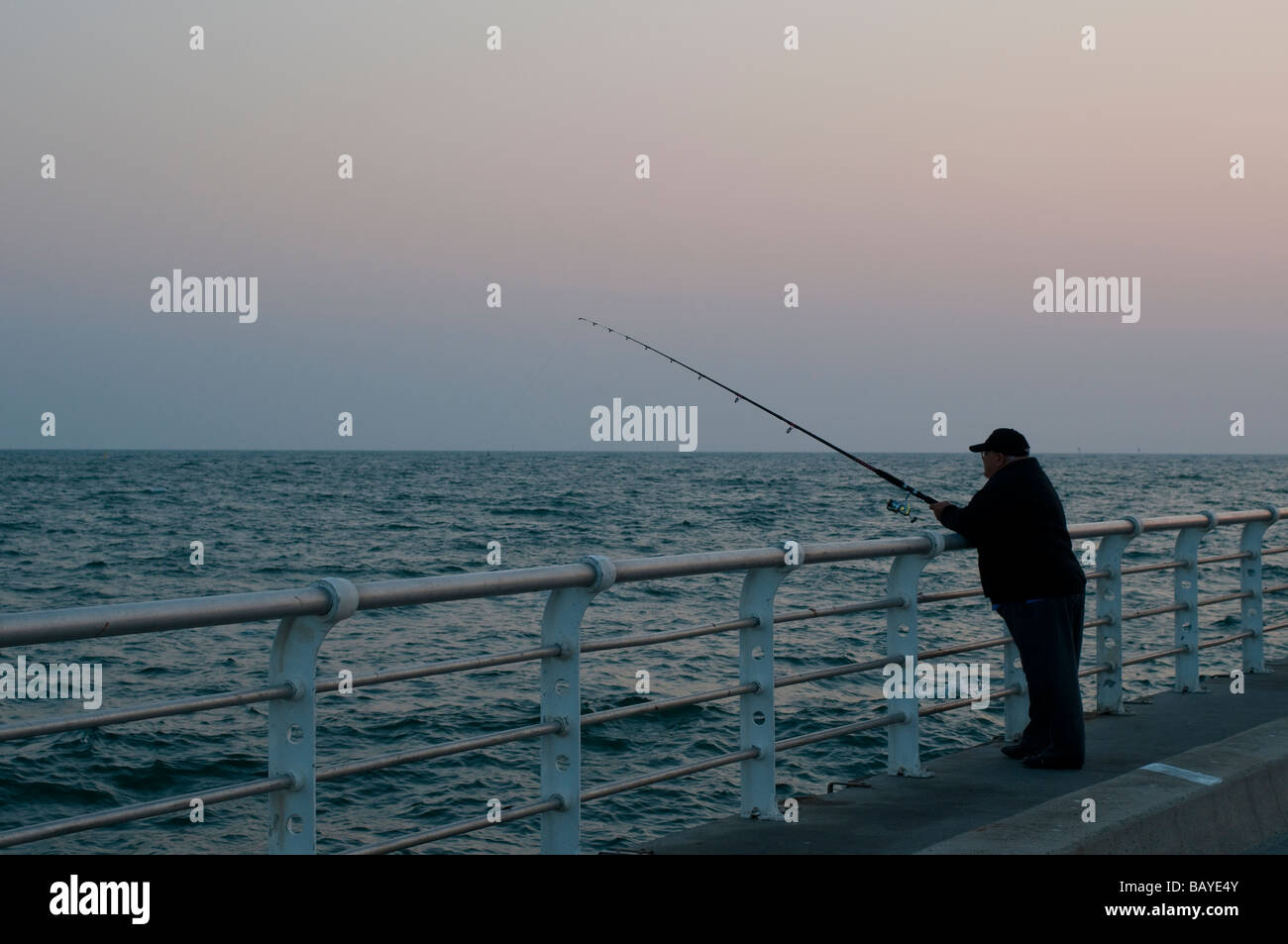 Man fishing at St Kilda pier Melbourne Victoria Australia Stock Photo