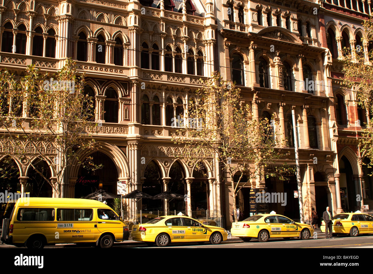 Taxis lined up in front of the old Rialto Hotel on Collins Street, Melbourne, Australia Stock Photo