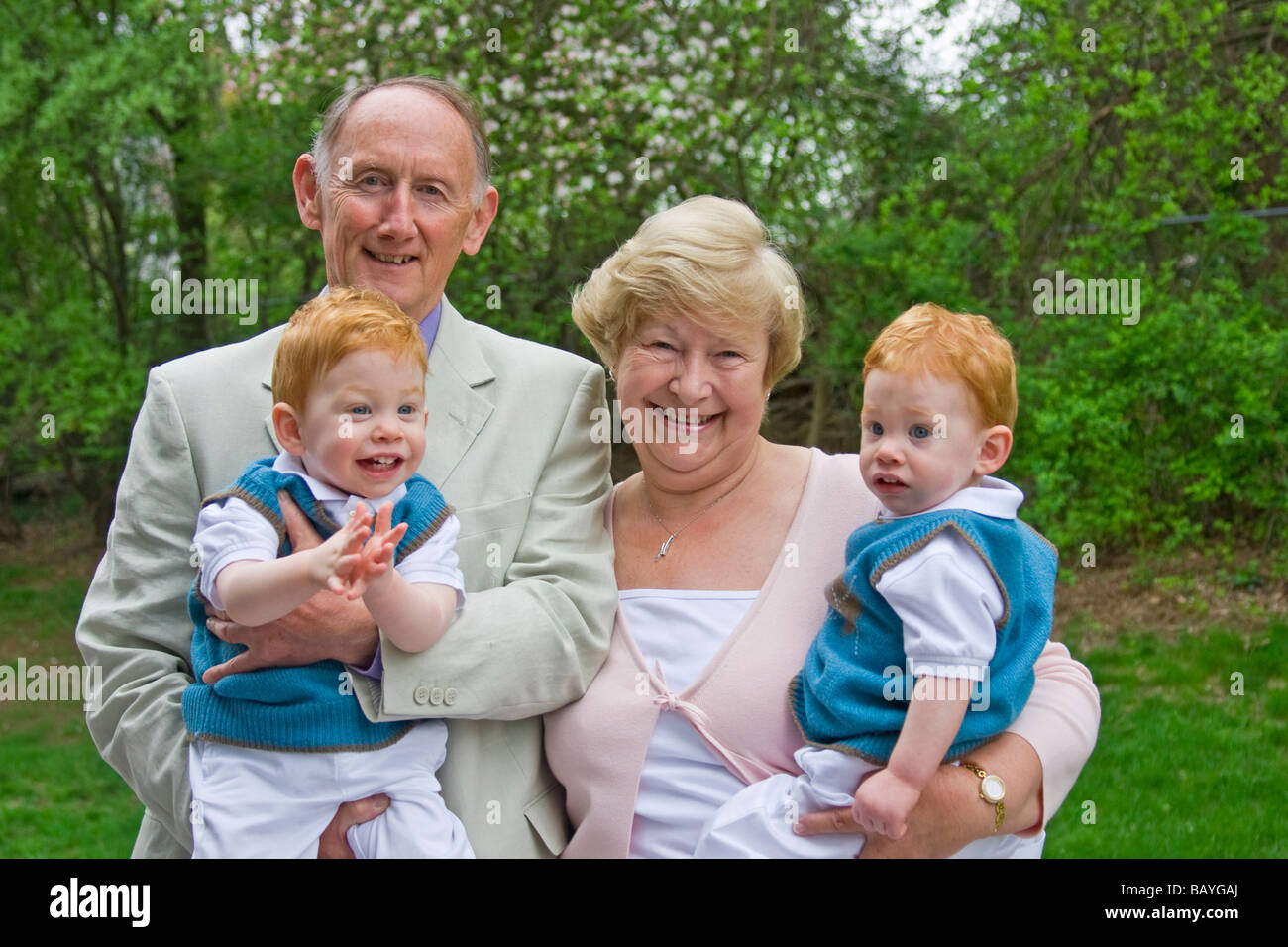 grandparents-holding-twin-grandsons-in-garden-stock-photo-alamy