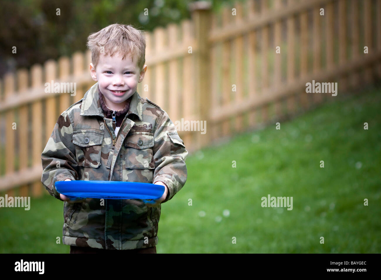 Happy boy smiling at camera Stock Photo - Alamy