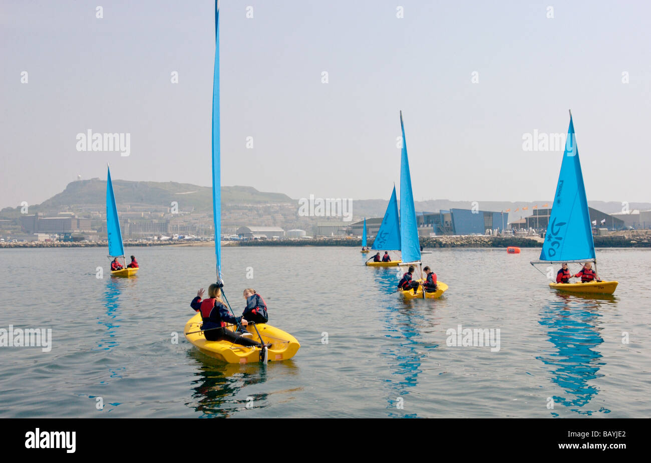 Young people sail training with a Laser Pico sailing dinghy at Weymouth