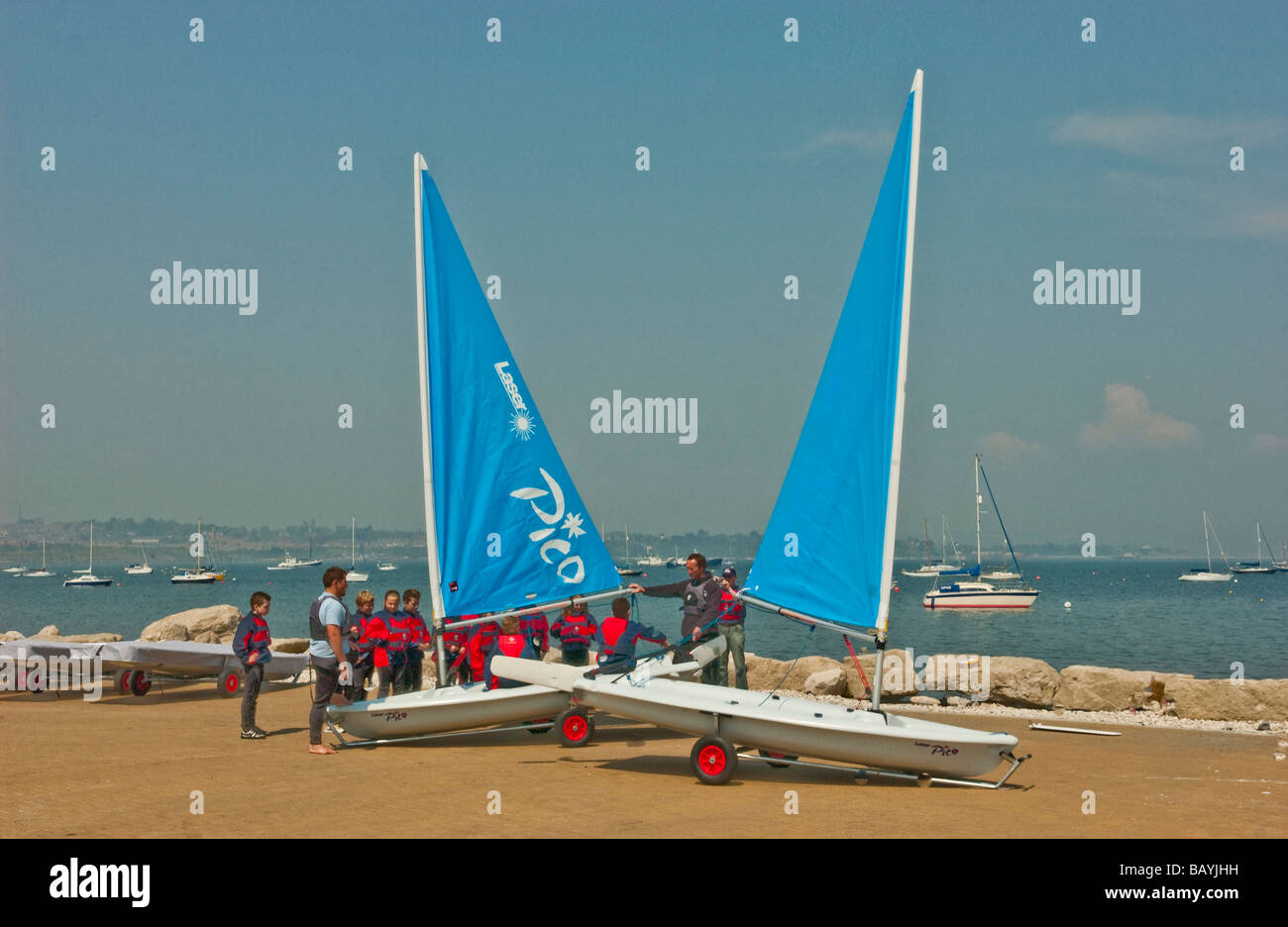Young people sail training with a Laser Pico sailing dinghy at Weymouth
