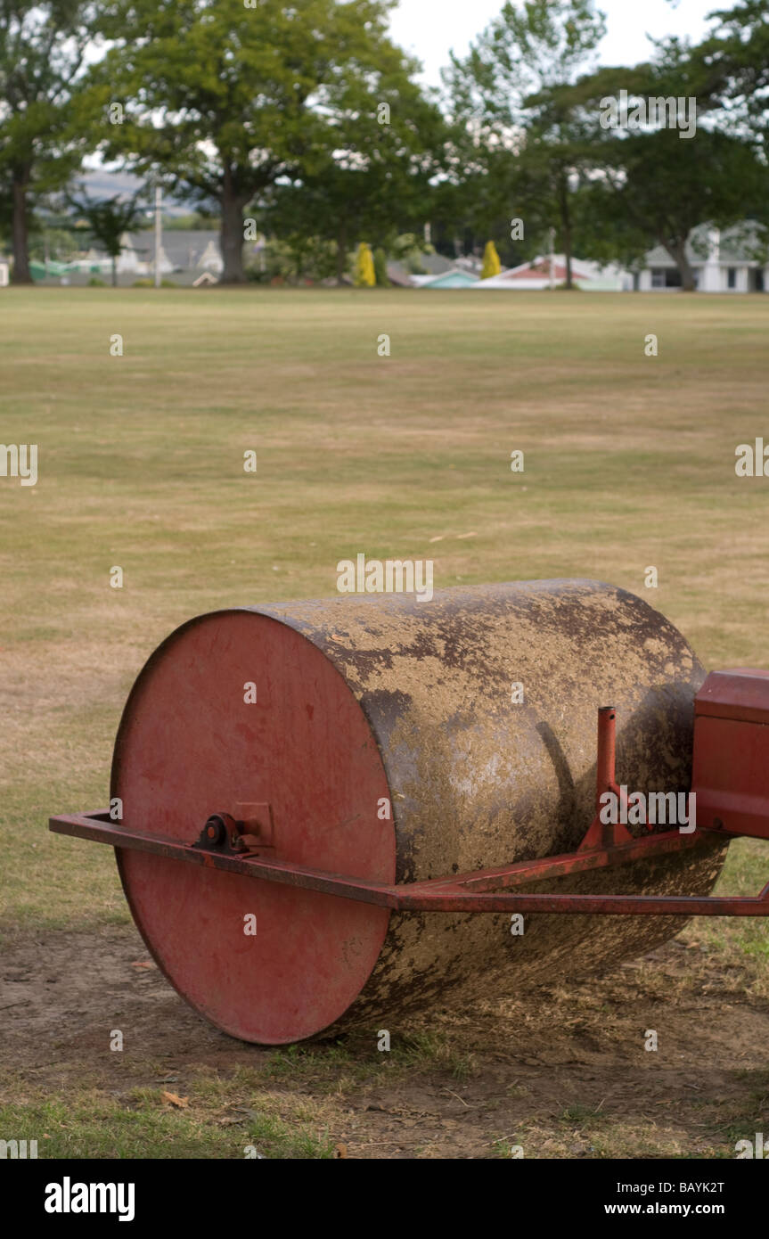 Heavy metal roller used to flat cricket pitch Stock Photo