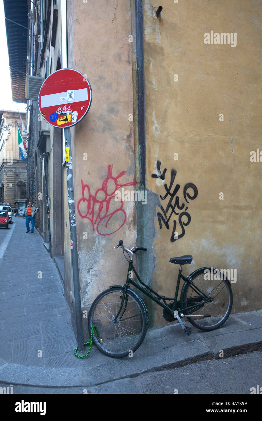 Bicycle locked to a sign post, Florence, Italy, April 22, 2009. Stock Photo