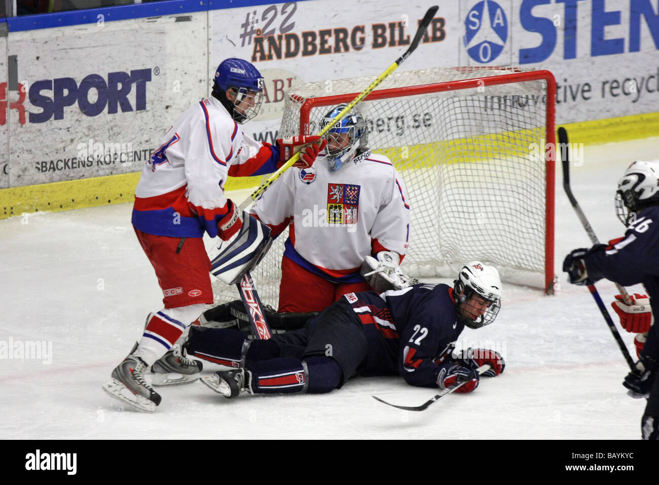 US player no 22 Chris McCarthy lying on the ice. The Czech goalkeeper is no 1 Petr Mrázek. Stock Photo