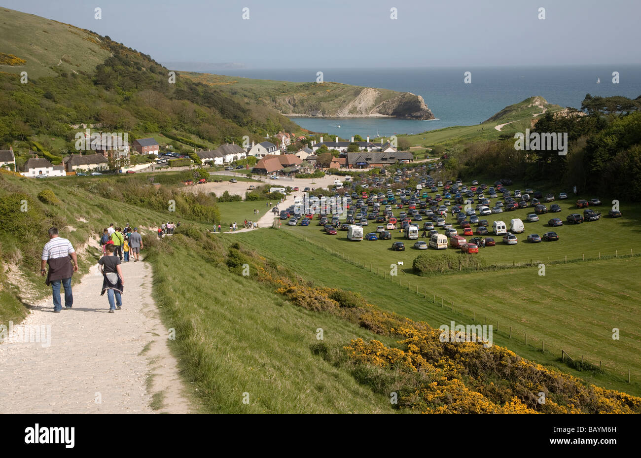 Crowded car park tourist honeypot site Lulworth Cove, Dorset, England