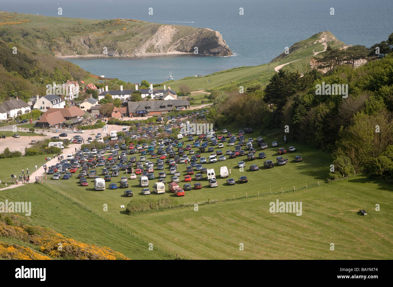 Crowded car park tourist honeypot site Lulworth Cove, Dorset, England