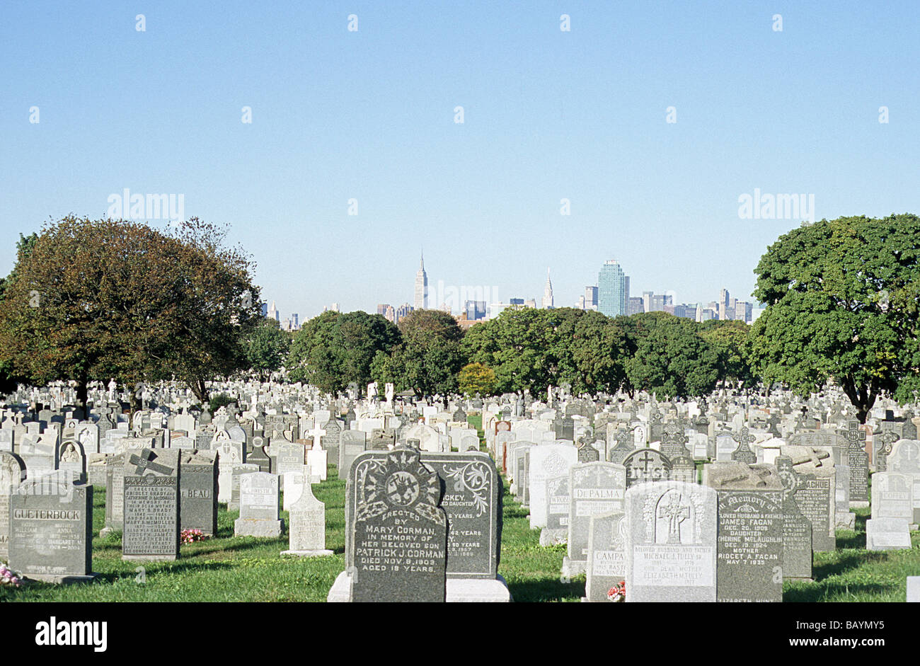 New York, New Calvary Cemetery, Queens, with Empire State building in the background Stock Photo