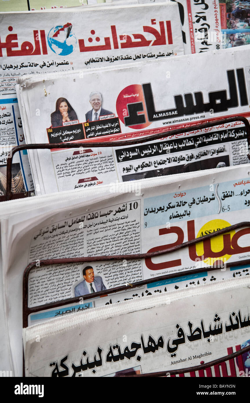 Rack of Arabic Moroccan newspapers, for sale in the Medina at Fes. Including Almassae and Annahar Al Maghribia. Press, daily Stock Photo