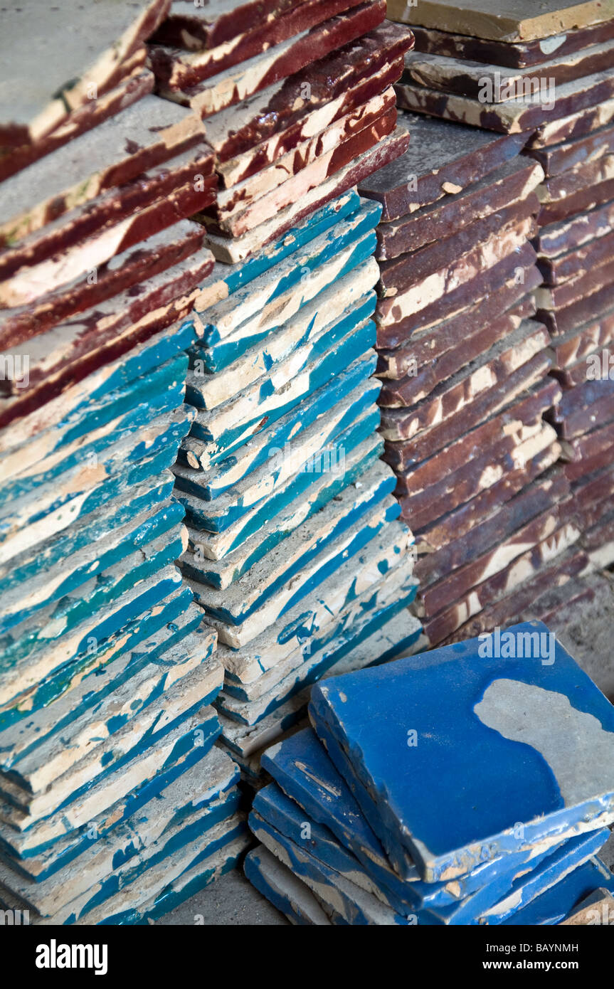 Piles of hand made ceramic tiles, stored ready to be cut up for mosaics. Used on tables, walls, fountains, details Stock Photo