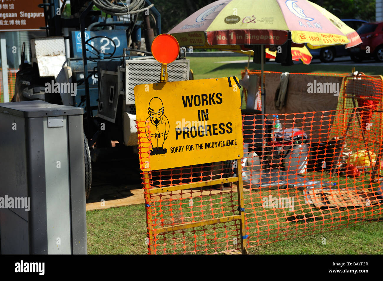 Very polite sign warning and apologising for Works In Progress. Singapore Stock Photo