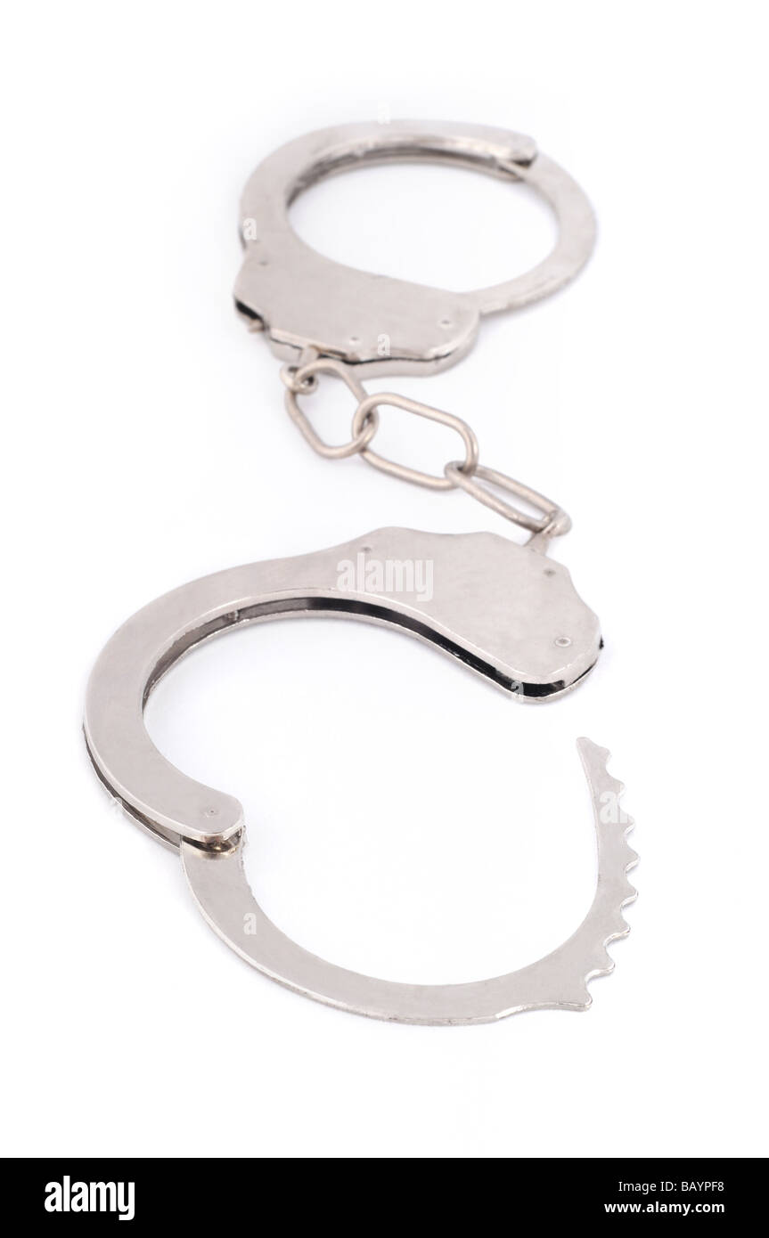 Silver metal handcuffs on white background. Stock Photo