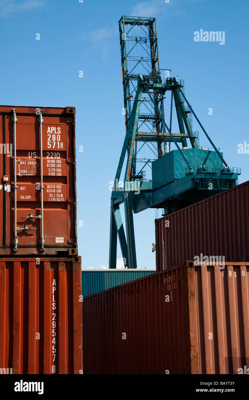 Crane and containers on a dockside ready for loading onto a container