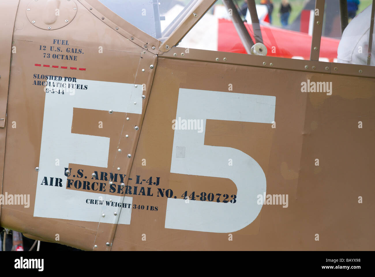 Markings on the fuselage of a WW2 era Piper L4-J spotter or light transport plane. Stock Photo