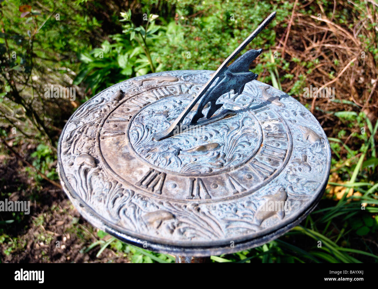 Garden sundial showing midday Stock Photo