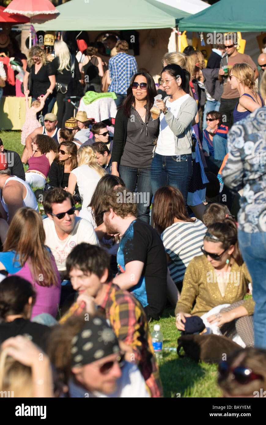 Community festivals, popular with young people, are held in city suburbs around Australia. Multicultural crowd; community festival; sociable people Stock Photo