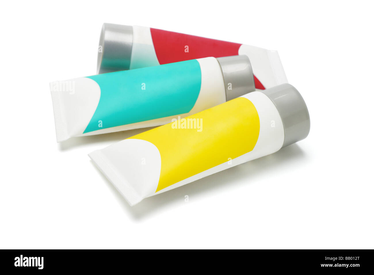 Three cosmetic tubes with colorful labels on white Stock Photo Alamy