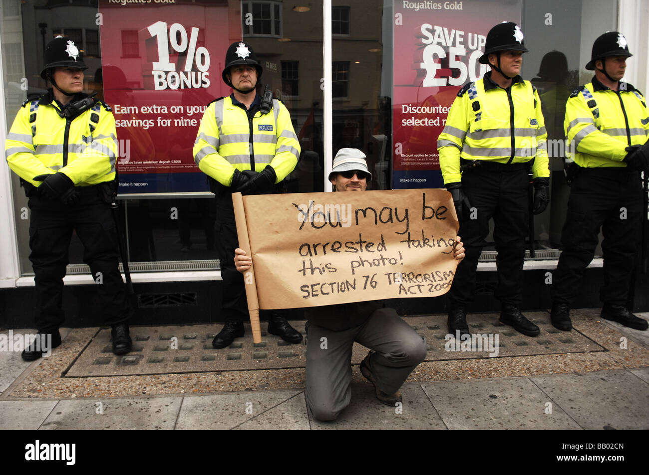Police protect the RBS bank office in Brighton during the Mayday Protests Stock Photo