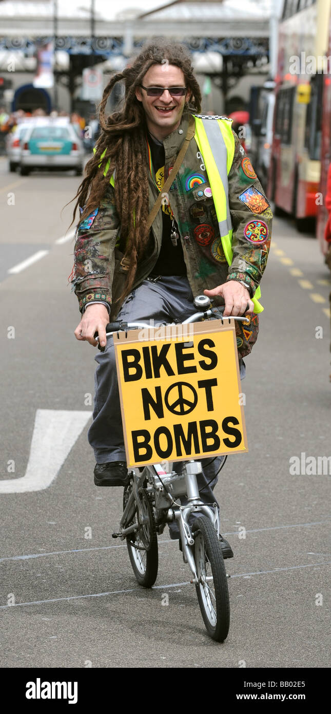 A cyclist with a Bikes Not Bombs slogan at the Mayday Protest in