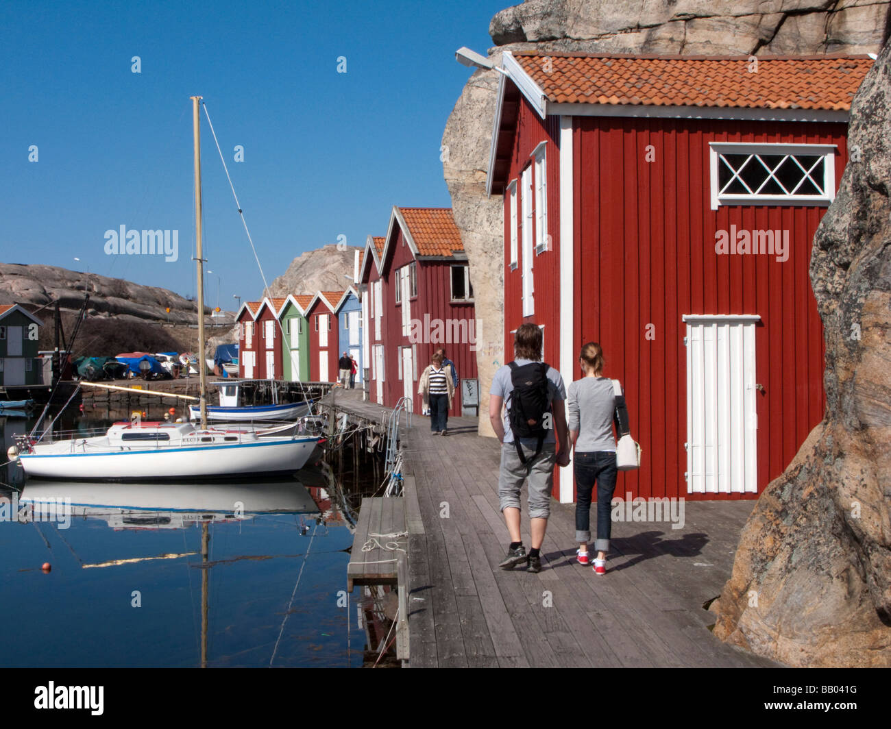 Traditional red wooden buildings in harbour in village of Smogen on Swedens Bohuslan coast Stock Photo
