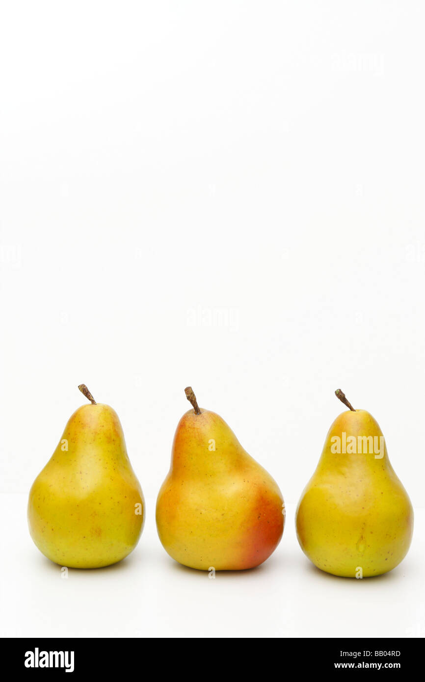 Three 3 Yellow Pears isolated on white background. Blank free white paper. Cutout (cut-out), nobody. May 2009 Stock Photo